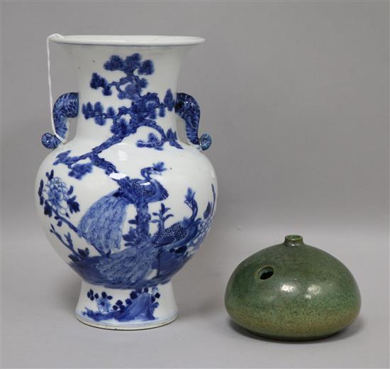 A Chinese blue and white vase and a green glazed water pot Vase Height 20cm.